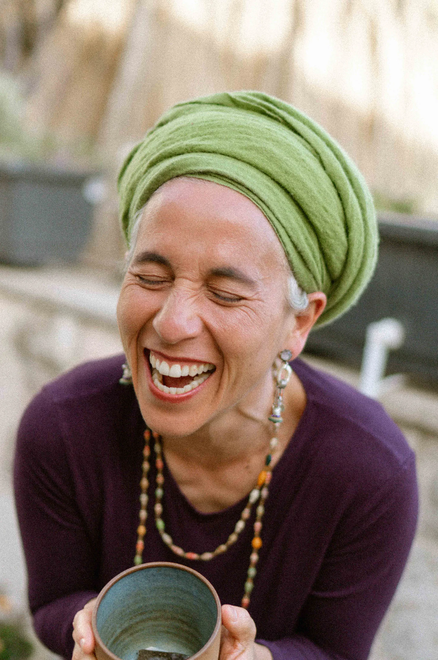 Chana Mason laughing with her head thrown back